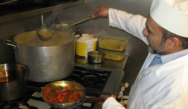 Balti Central's award winning chef cooks a king prawn dish